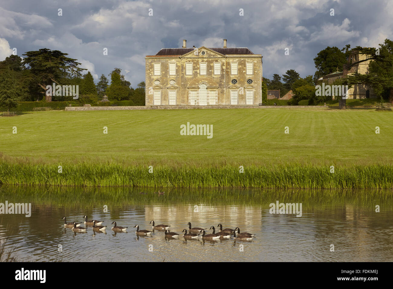View over the lake towards the west front at Claydon, Buckinghamshire. Stock Photo