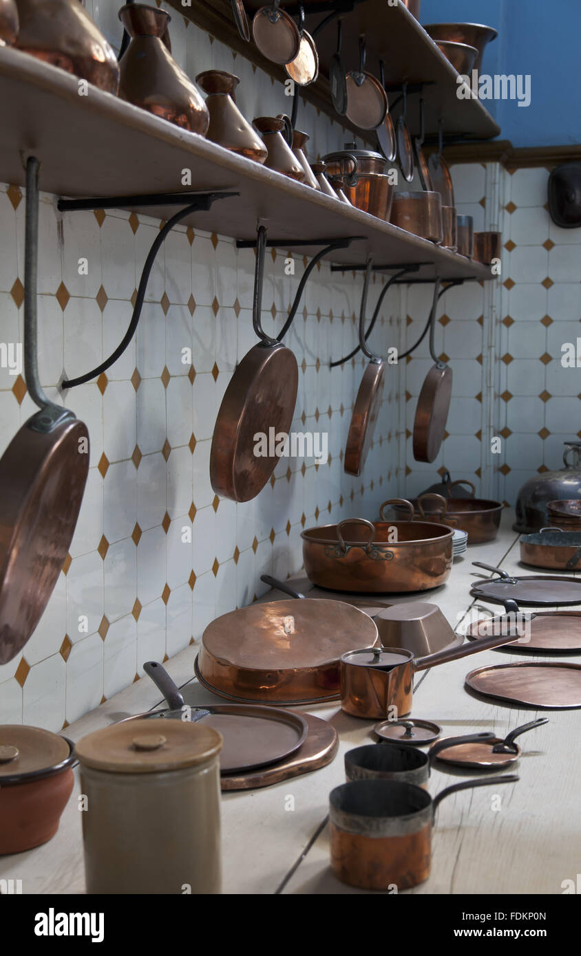 Copper pans in the Great Kitchen at Tredegar House, Newport, South Wales. Stock Photo