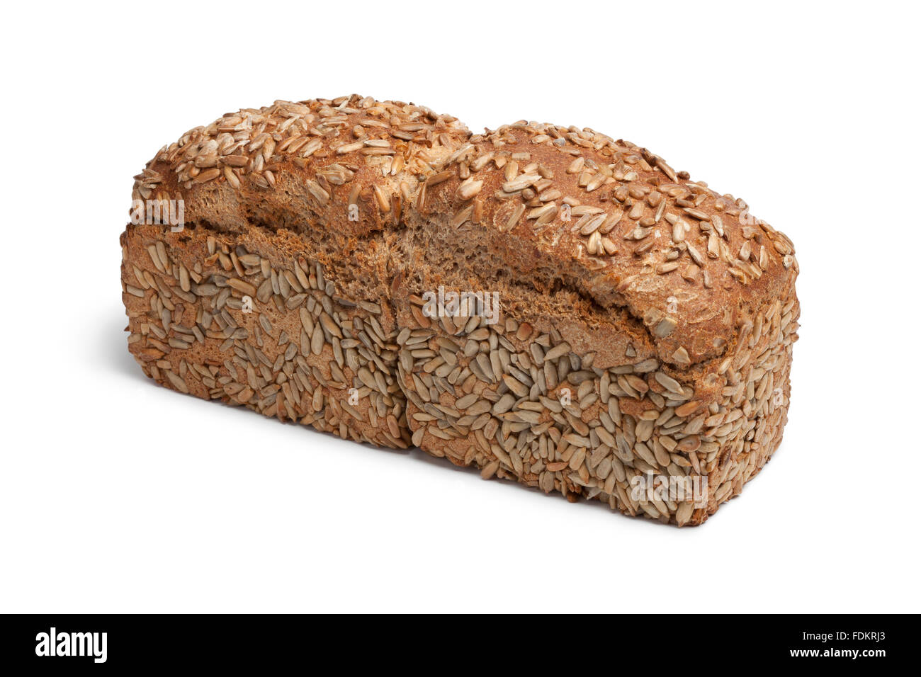 Whole loaf of spelt bread sunflower seeds on white background Stock Photo