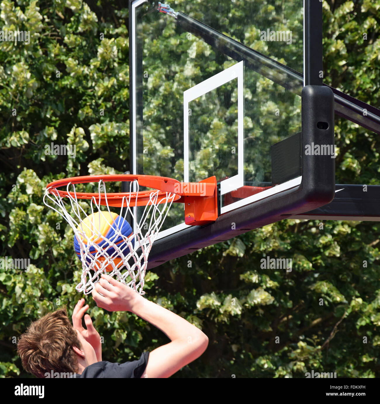 Playing basketball outdoors Stock Photo Alamy