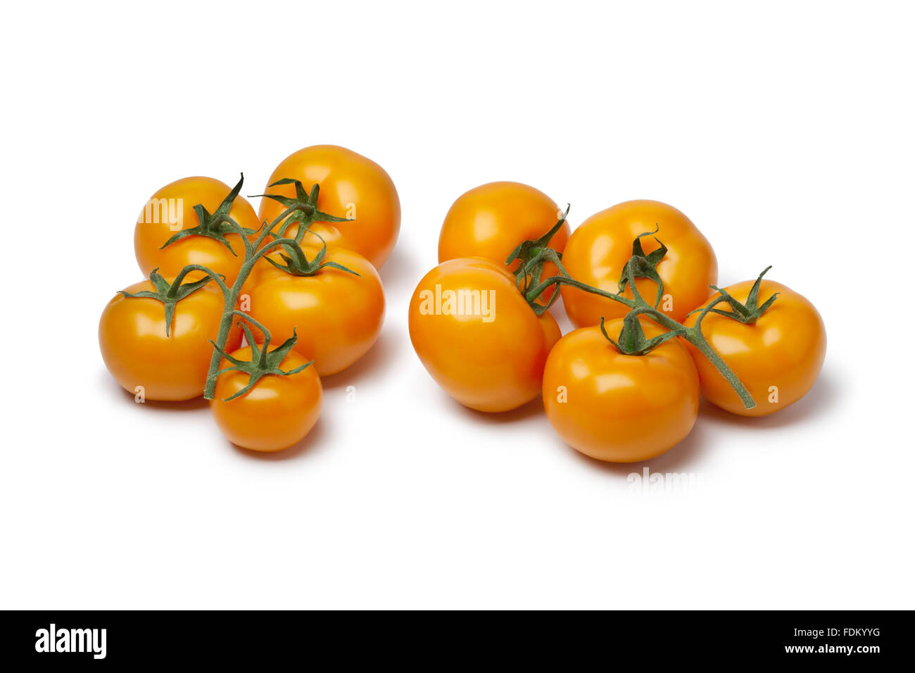 Fresh orange tomatoes on white background Stock Photo