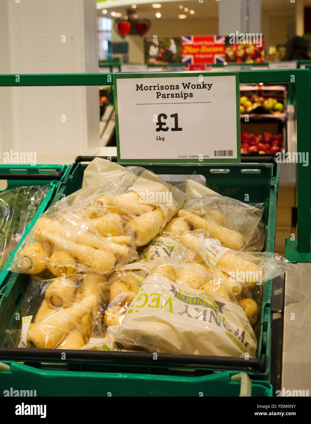 Morrisons supermarket have put 1kg bags of slightly misshapen or outside specification parsnips on sale in 1 kg bags Jan 2016 Stock Photo