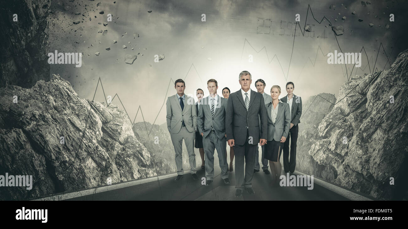 Composite image of smiling business team looking at camera Stock Photo ...