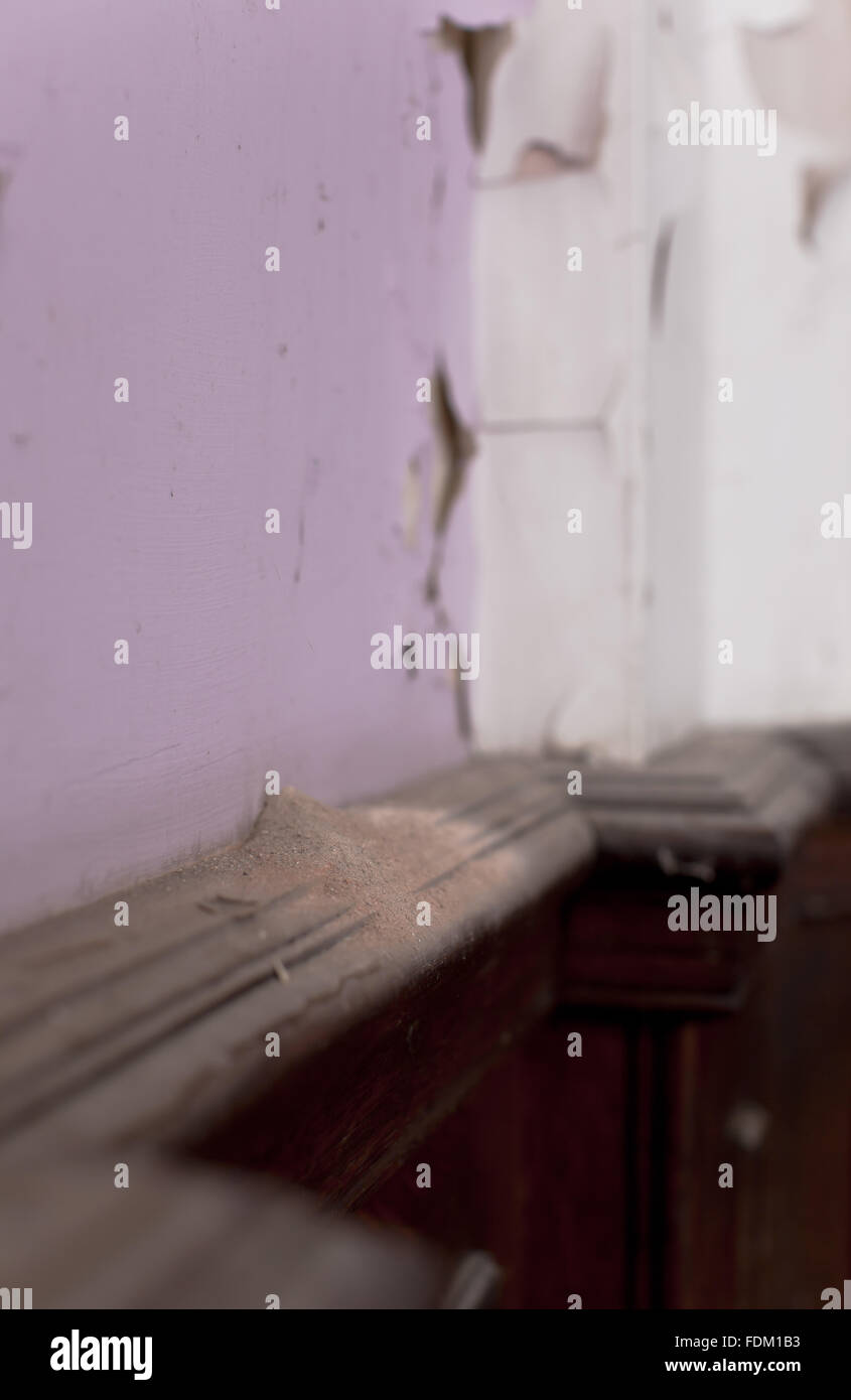 Peeling paint above wooden panelling at Dyffryn House, Vale of Glamorgan. Photograph taken in 2011 before conservation or restoration work undertaken. Stock Photo