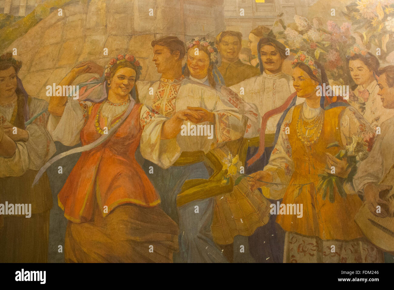 Socialist realist mural depicting a festival in Kiev at Kievskaya metro station platform, Moscow, Russia Stock Photo