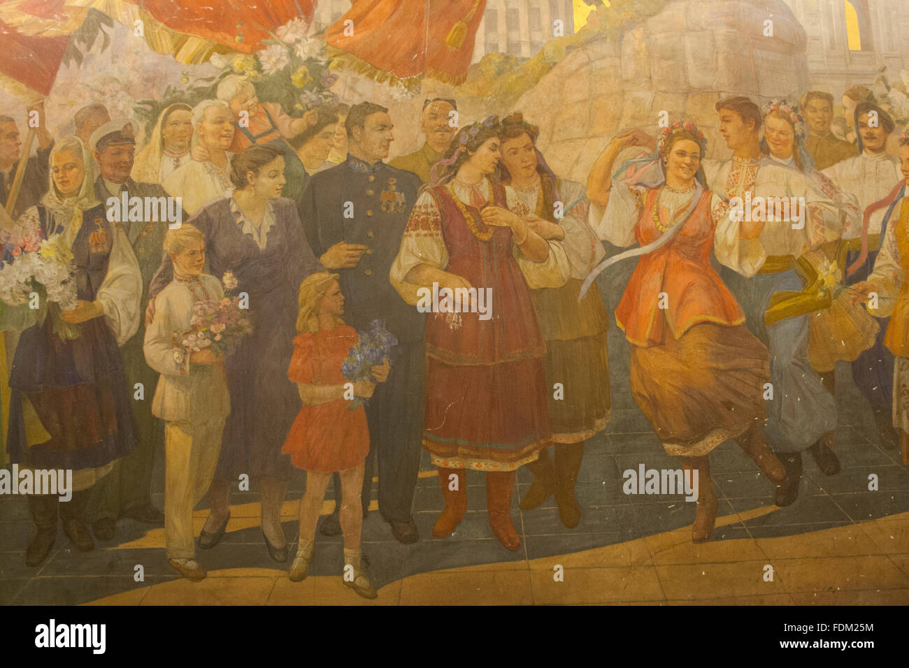 Socialist realist mural depicting a festival in Kiev at Kievskaya metro station platform, Moscow, Russia Stock Photo