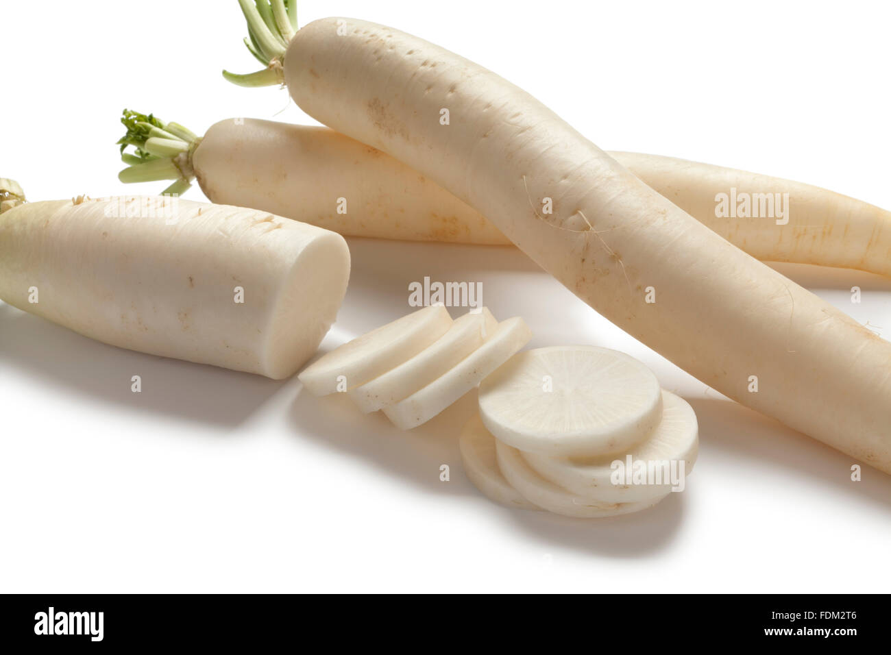 Fresh long white Radish and slices on white backgrpound Stock Photo