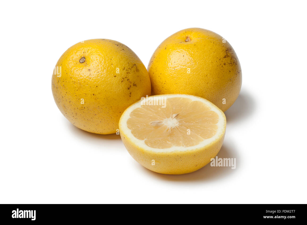 Whole and half white grapefruit on white background Stock Photo