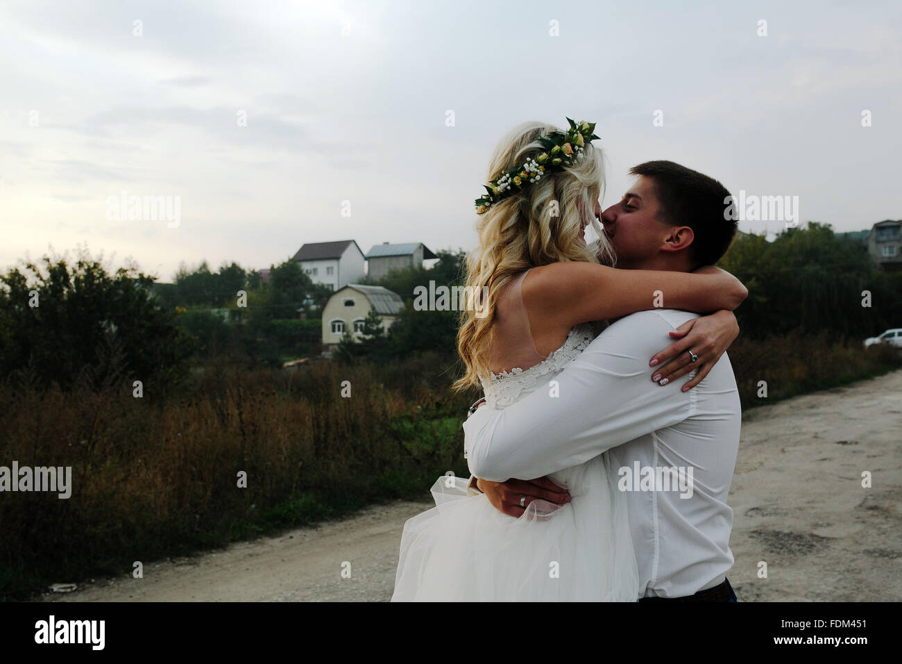Woman arms around man wedding hi-res stock photography and images - Alamy