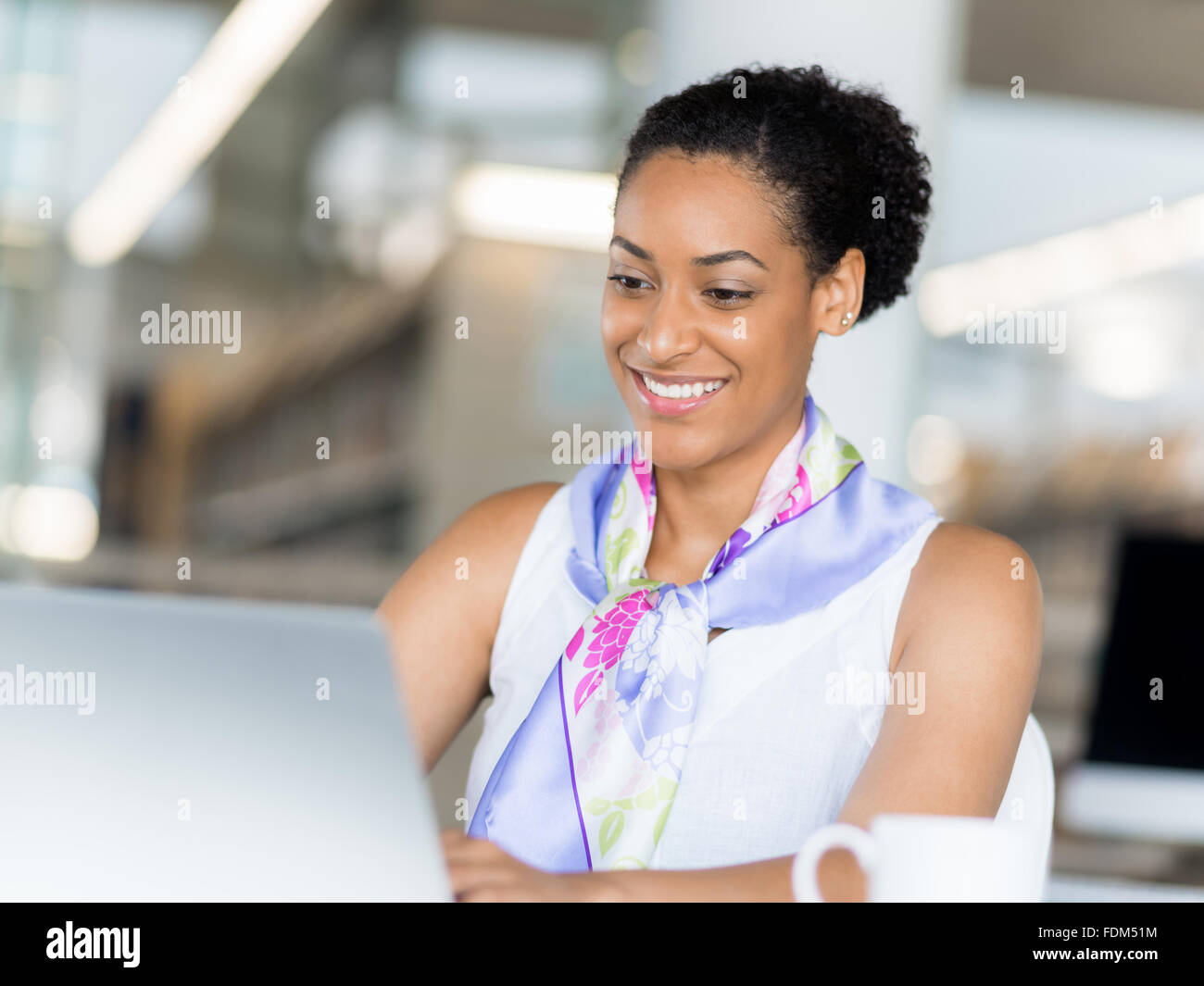 Young business woman working with laptop in office Stock Photo - Alamy
