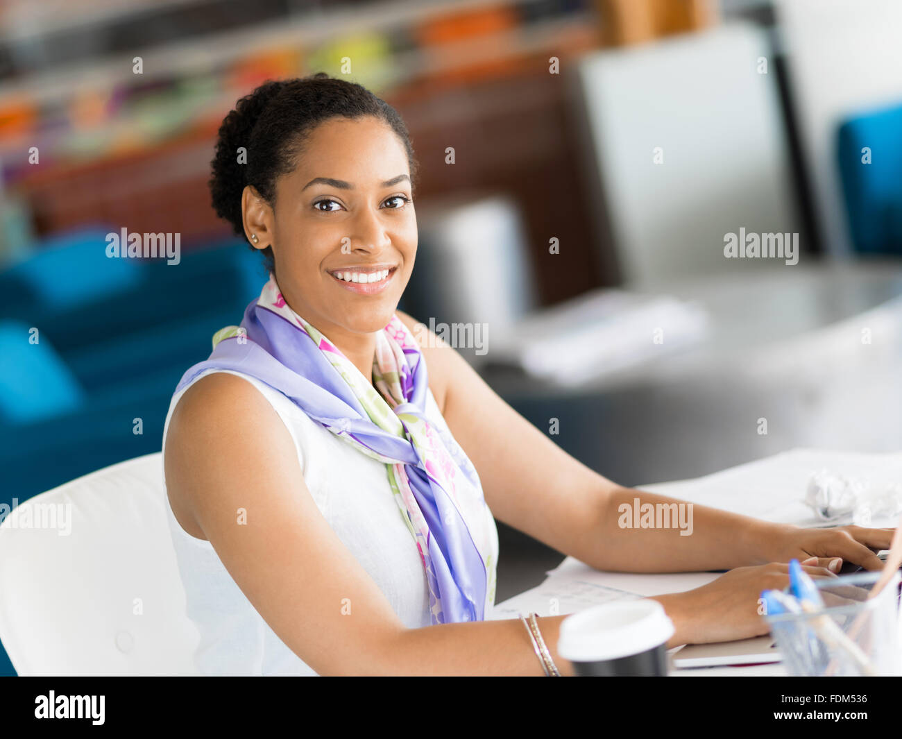 Young business woman working with laptop in office Stock Photo - Alamy