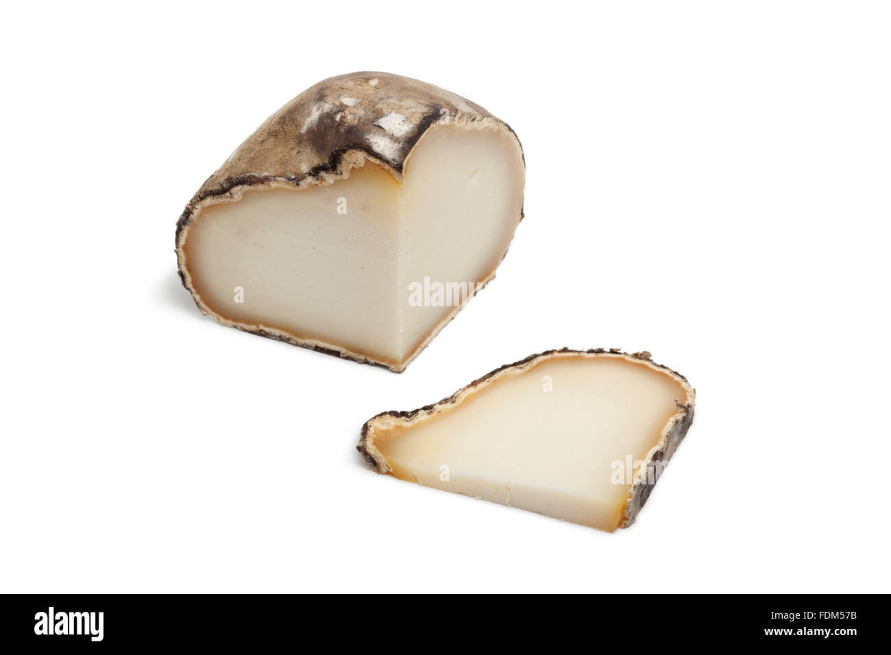 Piece of Spanish Manchego cheese on white background Stock Photo