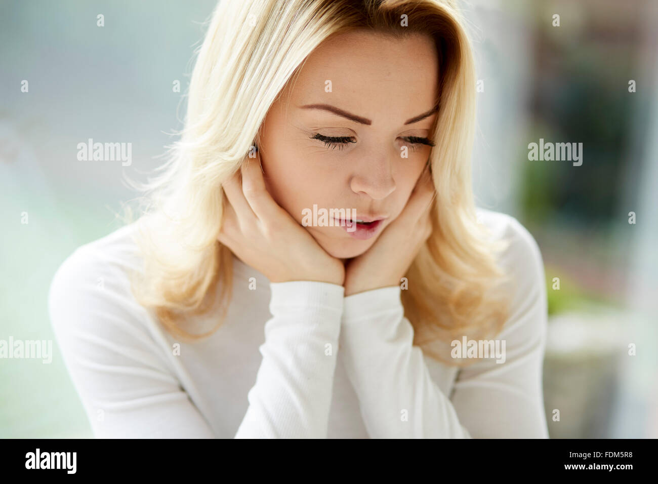 Woman looking anxious Stock Photo