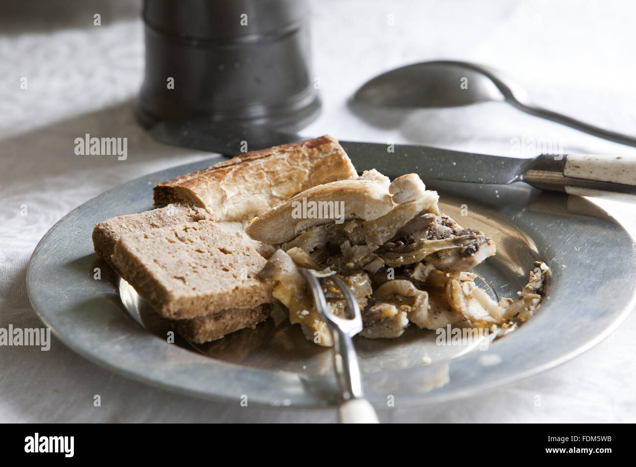 Food on a pewter plate in the Common Parlour at Wordsworth House, Cockermouth, Cumbria Stock