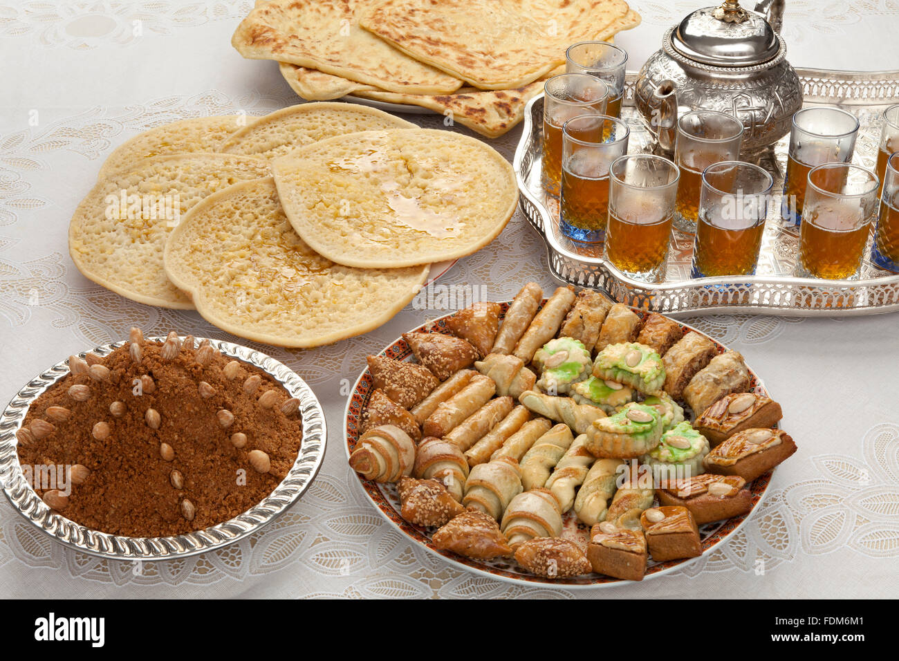 Traditional Moroccan tea,cookies, almond sellou and pancakes at id-al-fitr the end of Ramadan Stock Photo