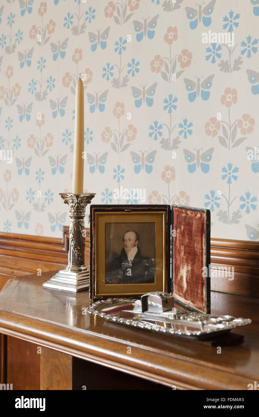 Mantelpiece and wallpaper designed by William Burges in the Boudoir at