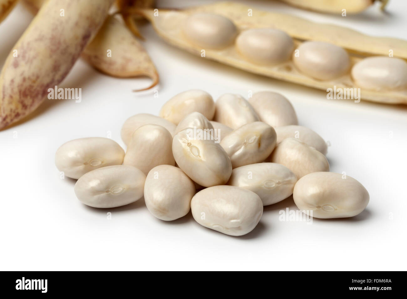 Peeled fresh white coco beans close up on white background Stock Photo