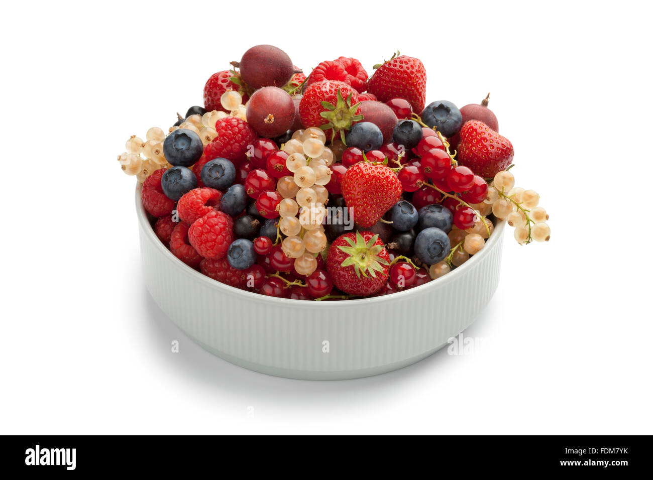 Bowl with summer fruit on white background Stock Photo