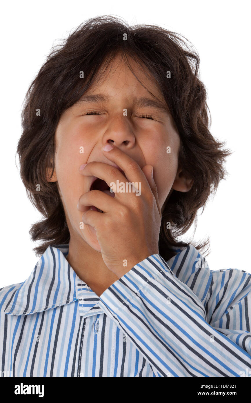 Yawning little boy on white background Stock Photo