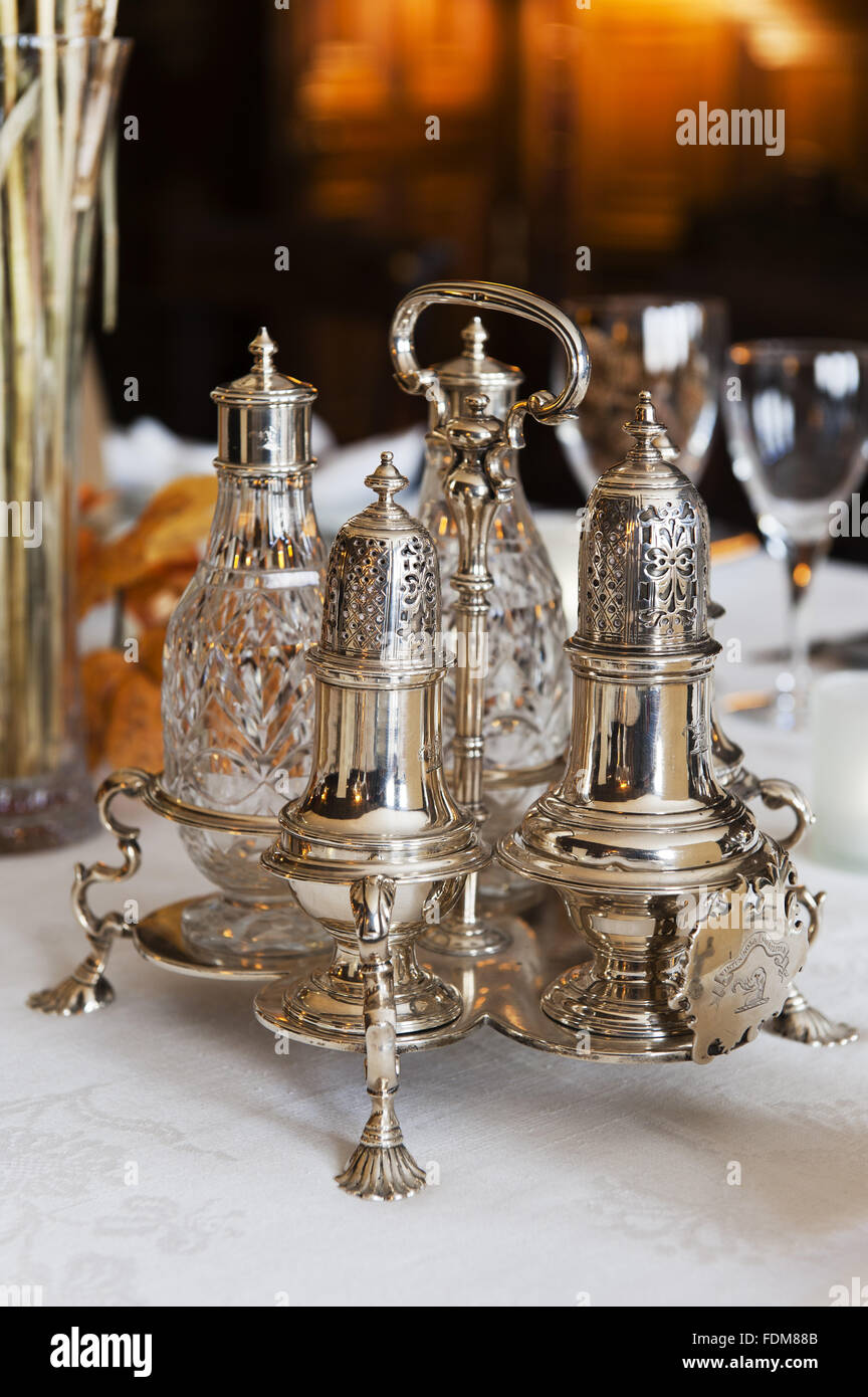 Eighteenth century, George III, silver cruet set in the Dining Room at Coughton Court, Warwickshire. Stock Photo
