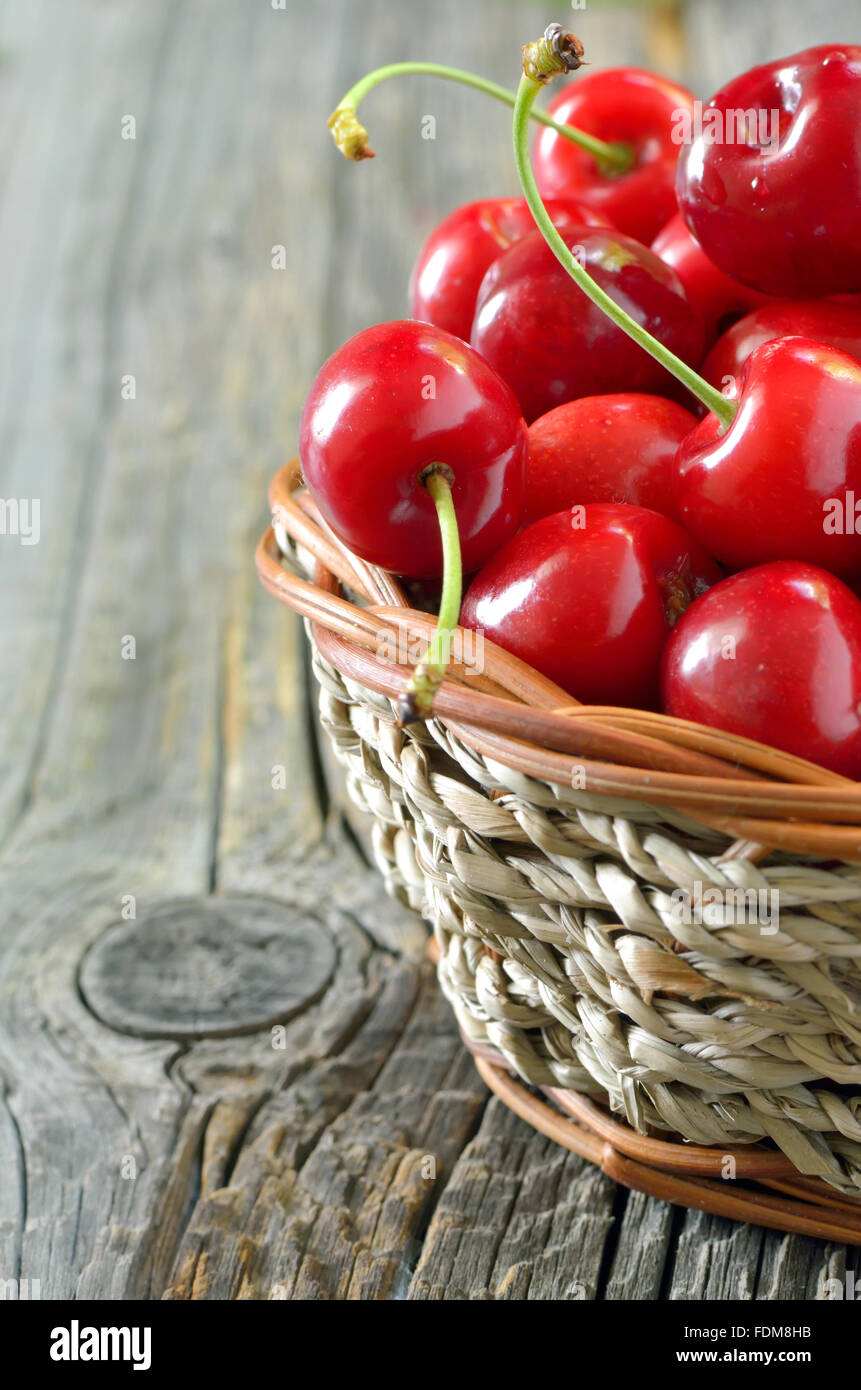 red sweet cherries in a  basket Stock Photo