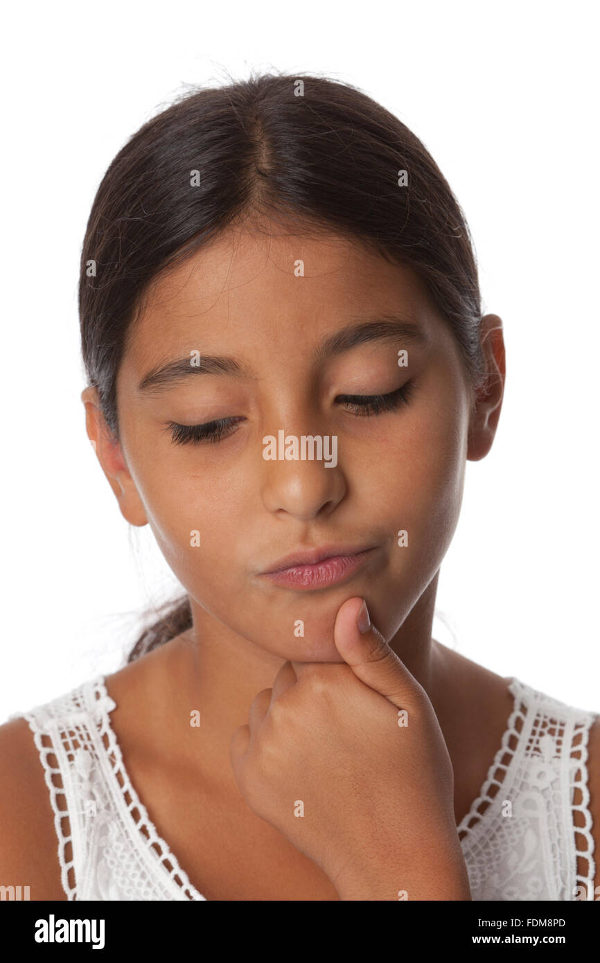 Young uncertain teenage girl, portrait on white background Stock Photo