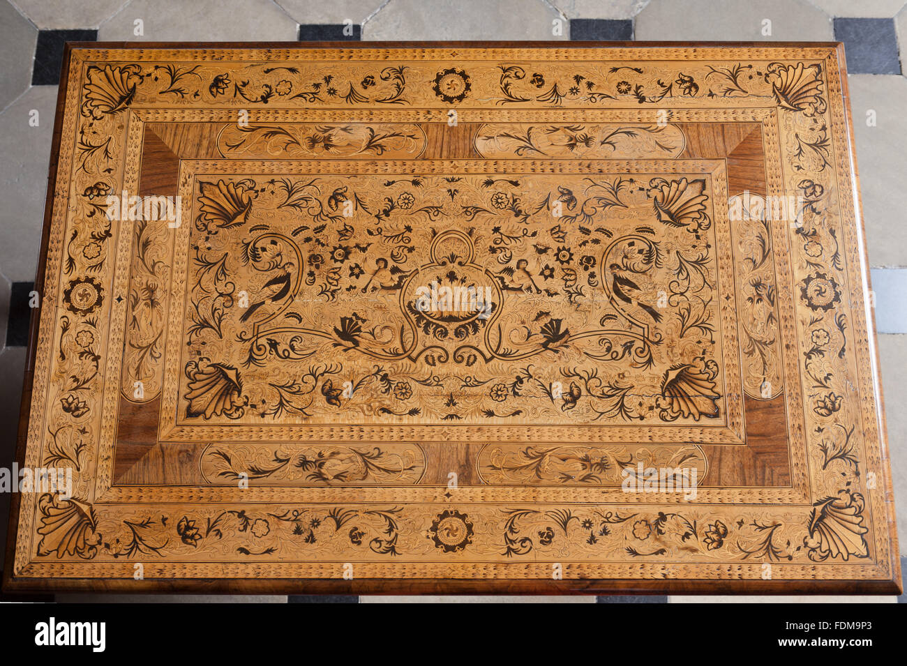 The top of the seaweed marquetry table in the Stone Parlour at Dunham Massey, Cheshire. The table is Anglo Dutch, late seventeenth century. NT inventory number 930618. Stock Photo