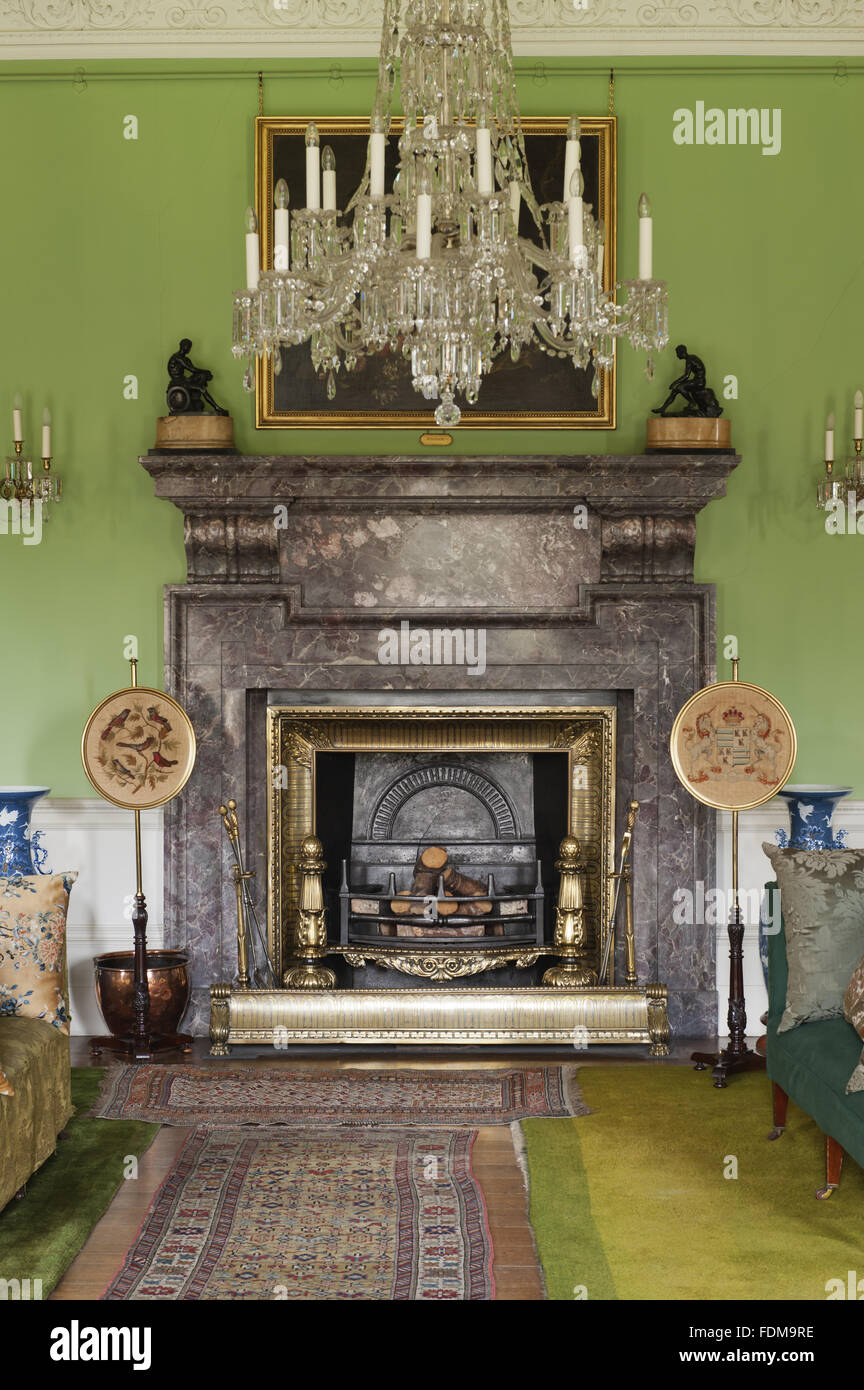 The marble fireplace, designed by John Shaw in 1822, in the Saloon at Dunham Massey, Cheshire. Stock Photo