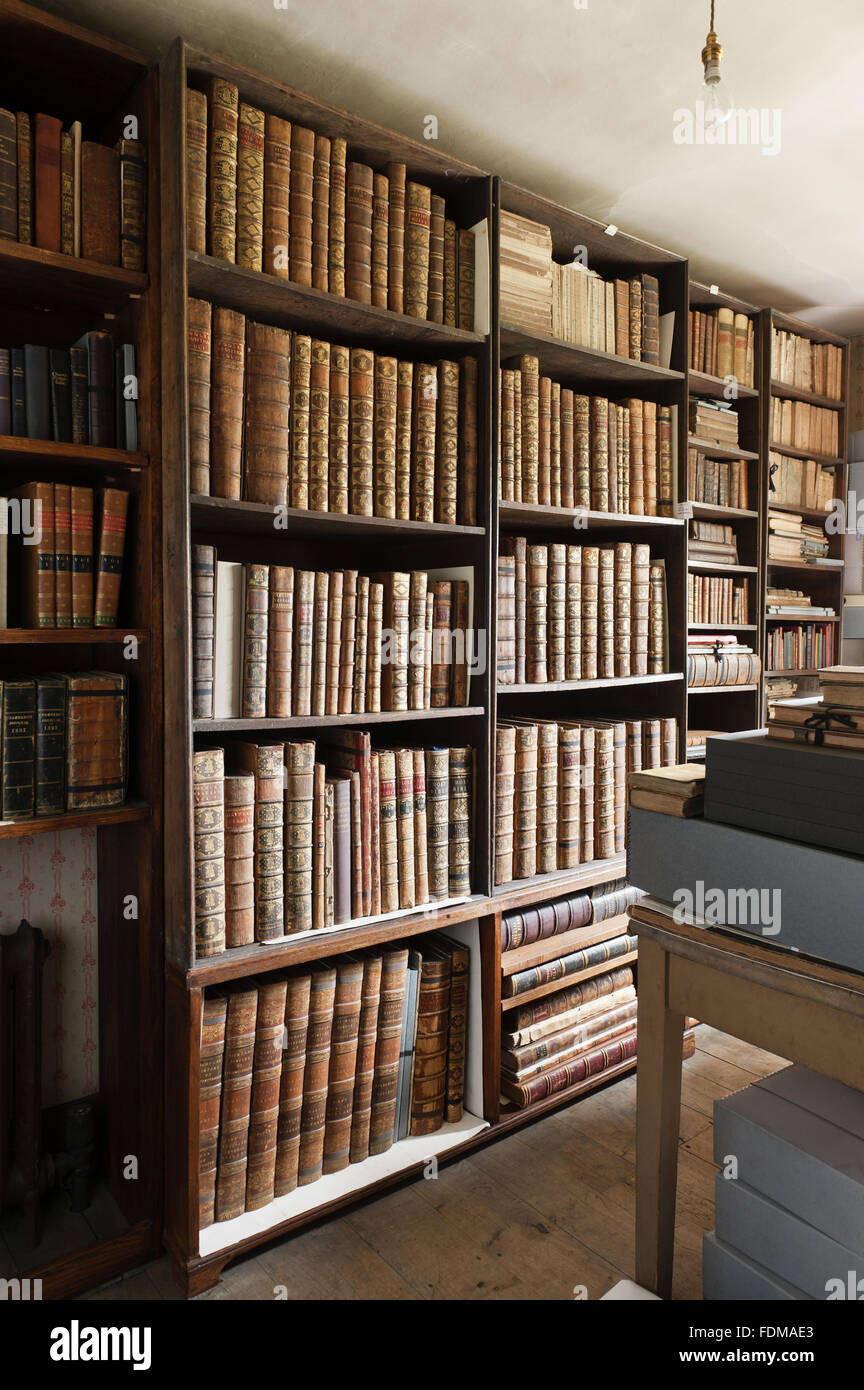 Bookshelves in the Instrument Room at Dunham Massey, Cheshire. Stock Photo