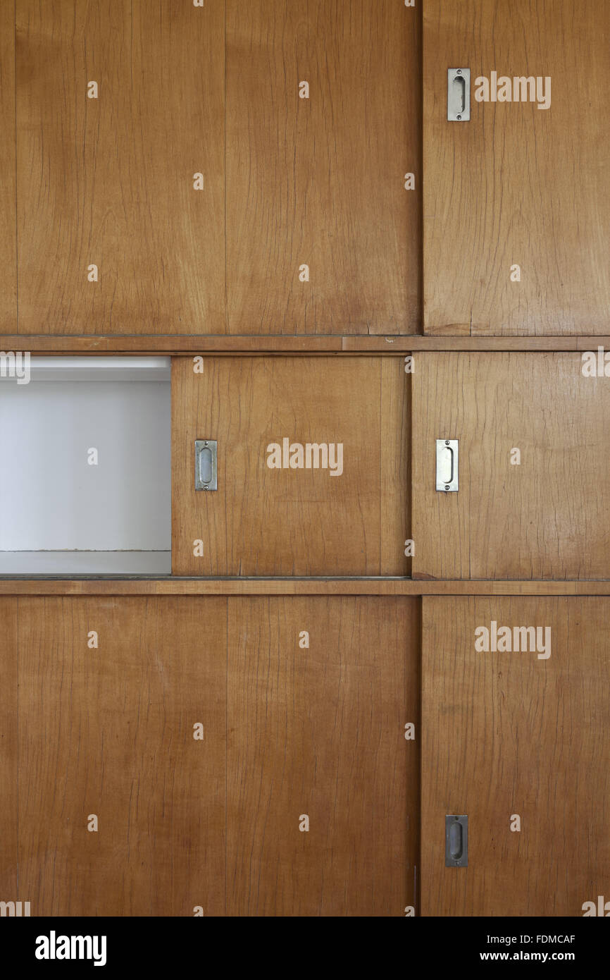 The Plywood Cupboards With Sliding Hatch Doors In The Dining