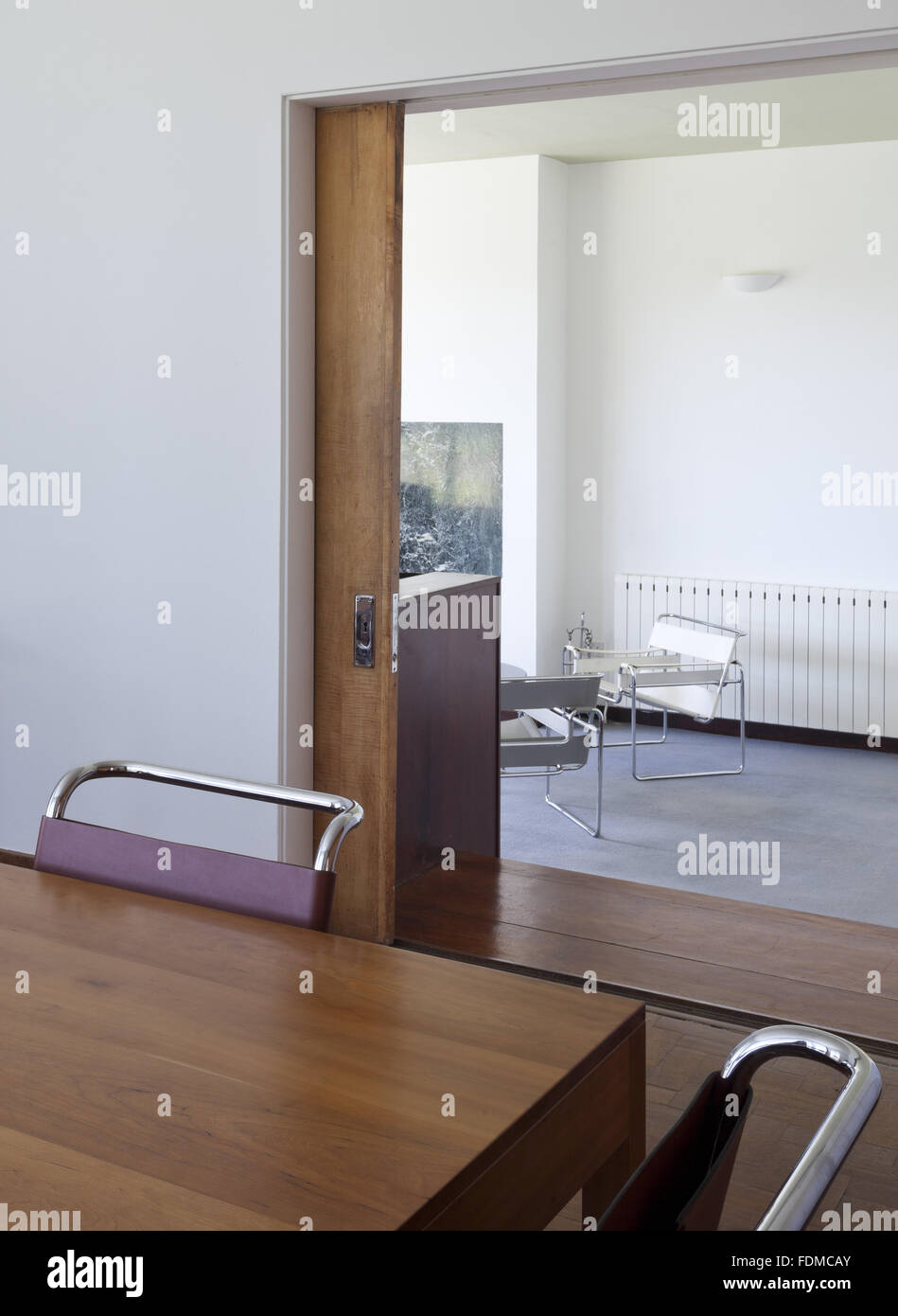 A View Over The Dining Table Towards The Sliding Door And