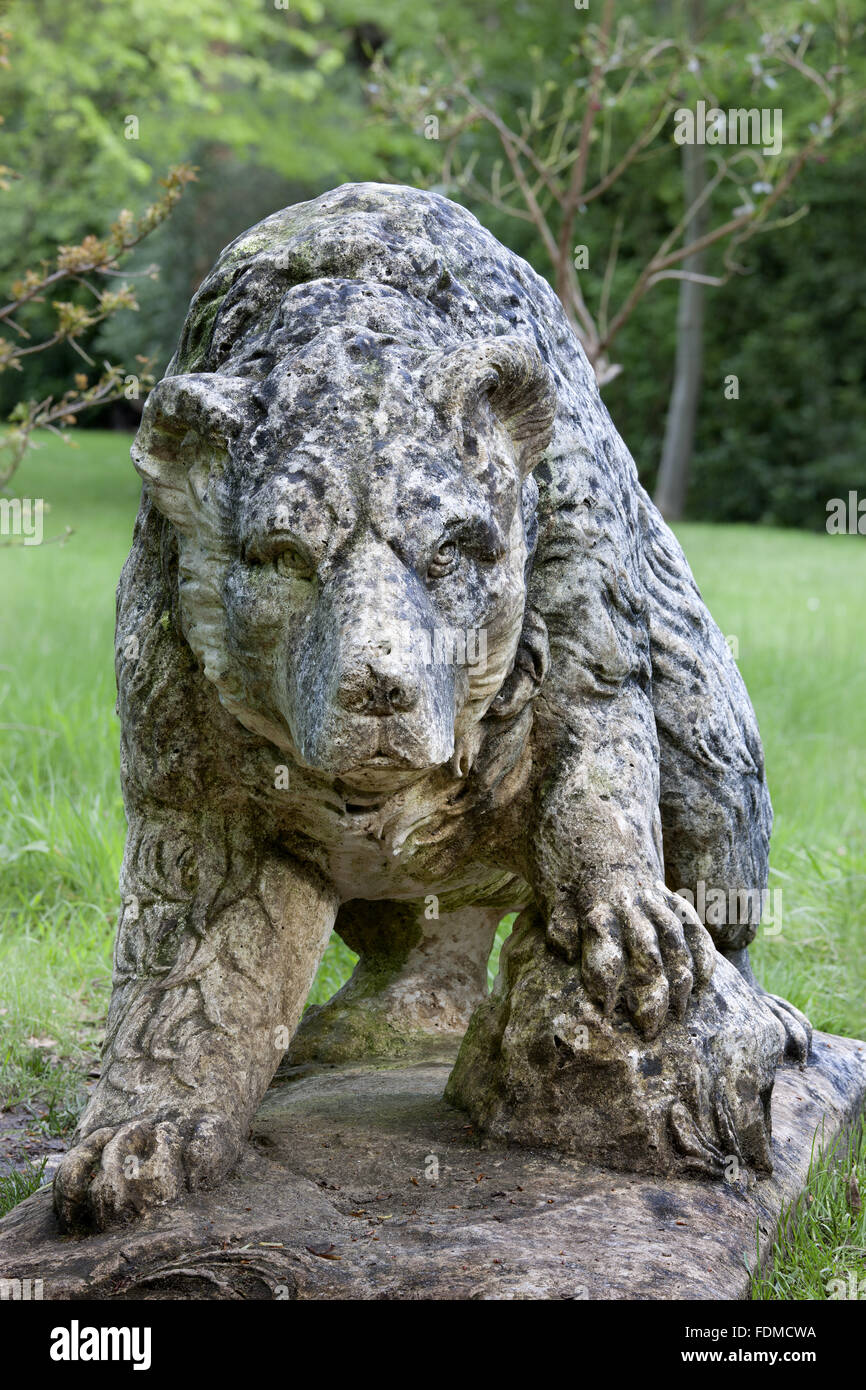 The stone Bear statue at Claremont Landscape Garden, Surrey Stock Photo