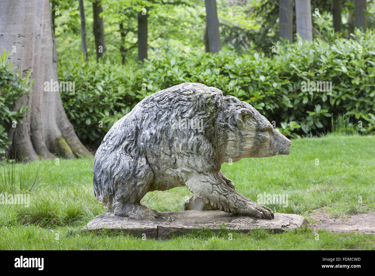 The stone Bear statue at Claremont Landscape Garden, Surrey Stock Photo