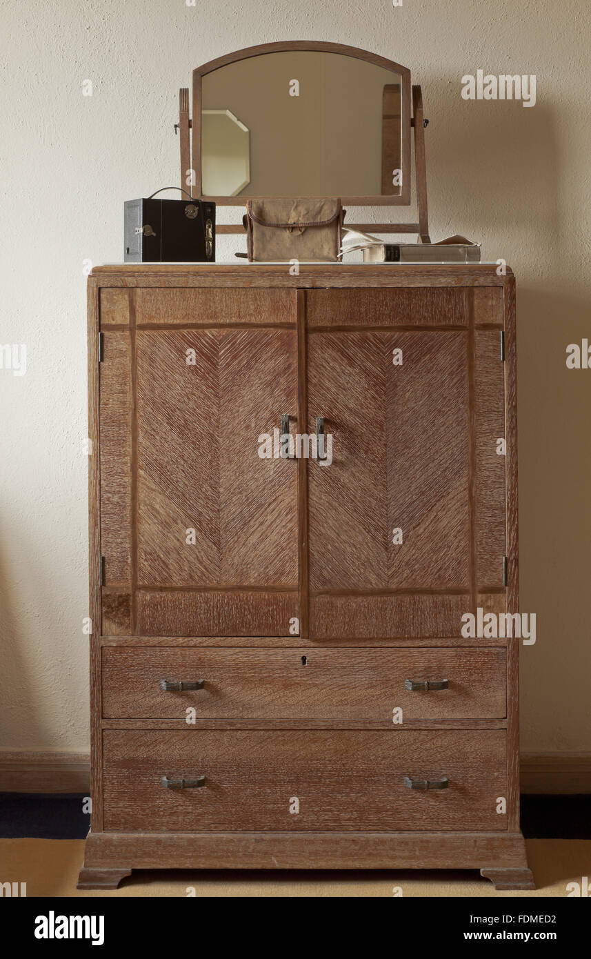 Limed oak dressing cupboard unit in the Turret Dressing Room at Coleton Fishacre, Devon Stock