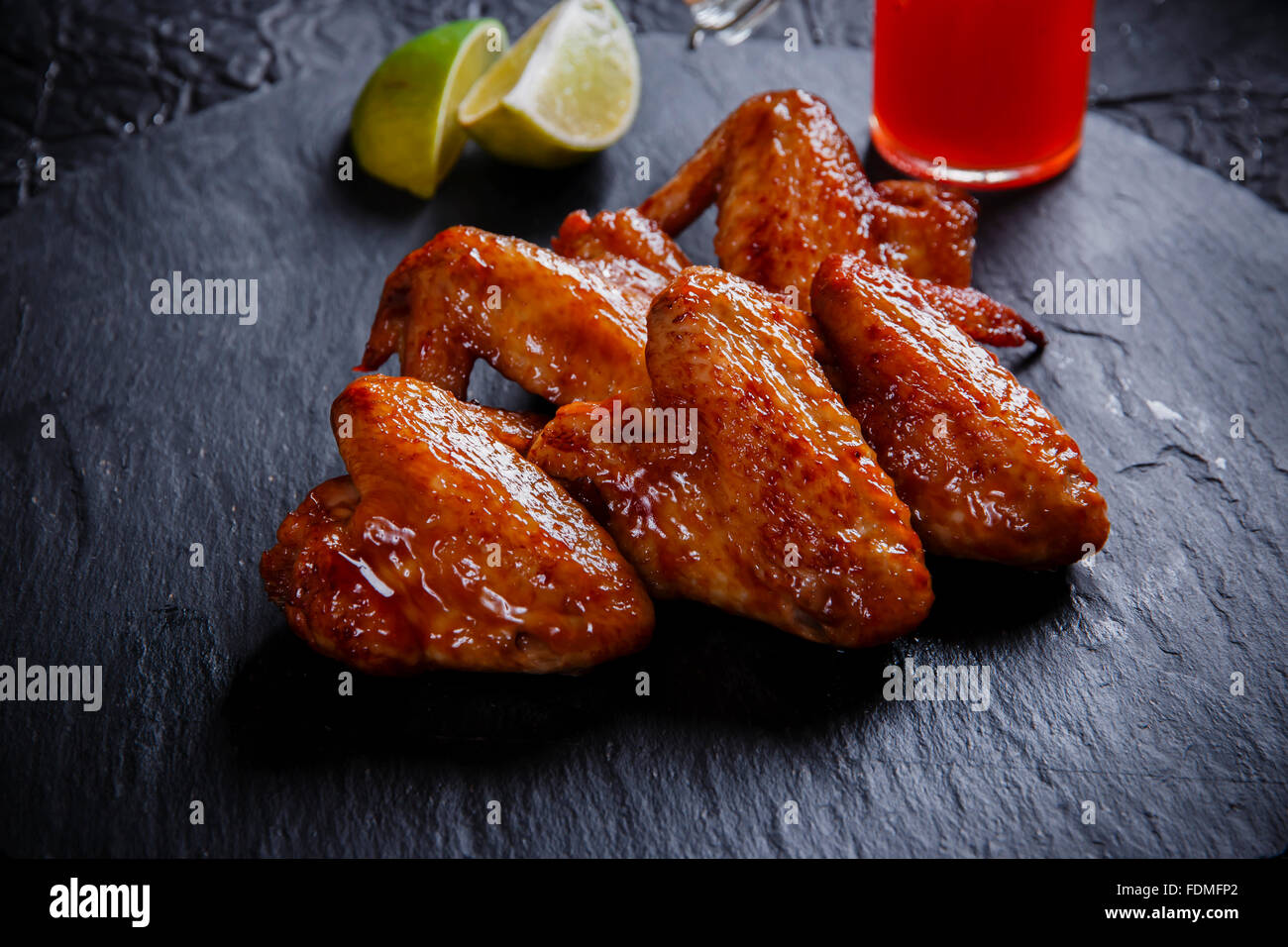 fried chicken wings on a black stone Stock Photo