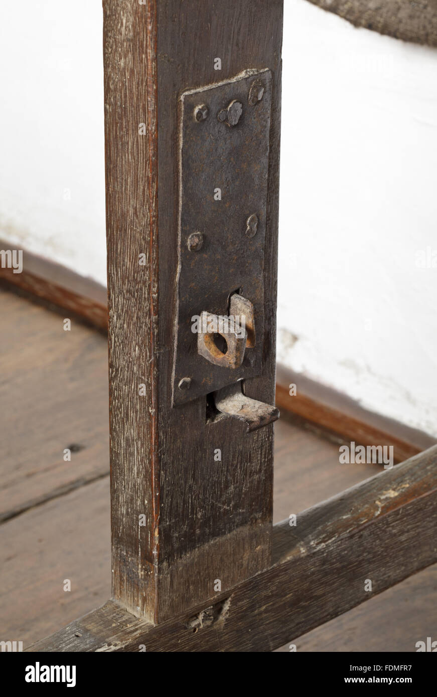 Close view of the folding mechanism of a seventeenth-century 'Spanish' table, probably made on the Cotehele estate, in the Red Room at Cotehele, Cornwall. Stock Photo