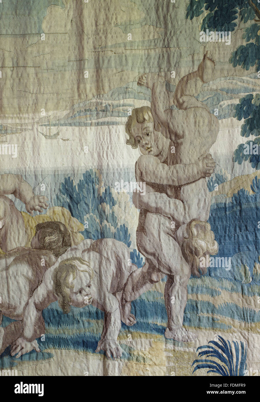 Close view of part of the Antwerp tapestry, c.1660-80, from the workshop of Philip Wauters, in the Red Room at Cotehele, Cornwall. The tapestry is from a set of four depicting Children's Games - this one shows the game of 'Fart in the Face', a translation Stock Photo