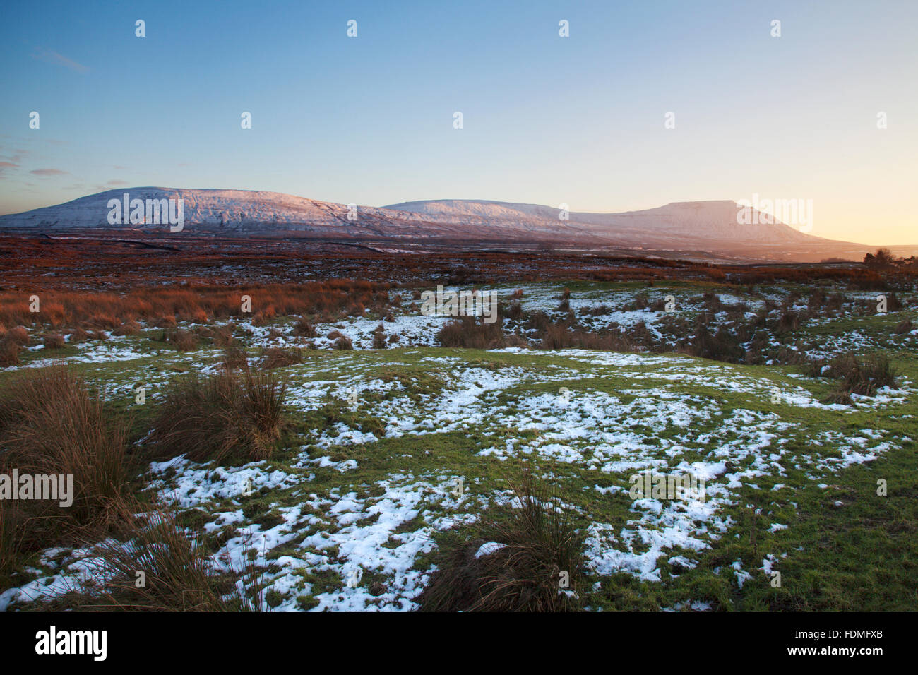 Park Fell Simon Fell and Ingleborough at Sunset in Winter Ribblehead Yorkshire Dales England Stock Photo