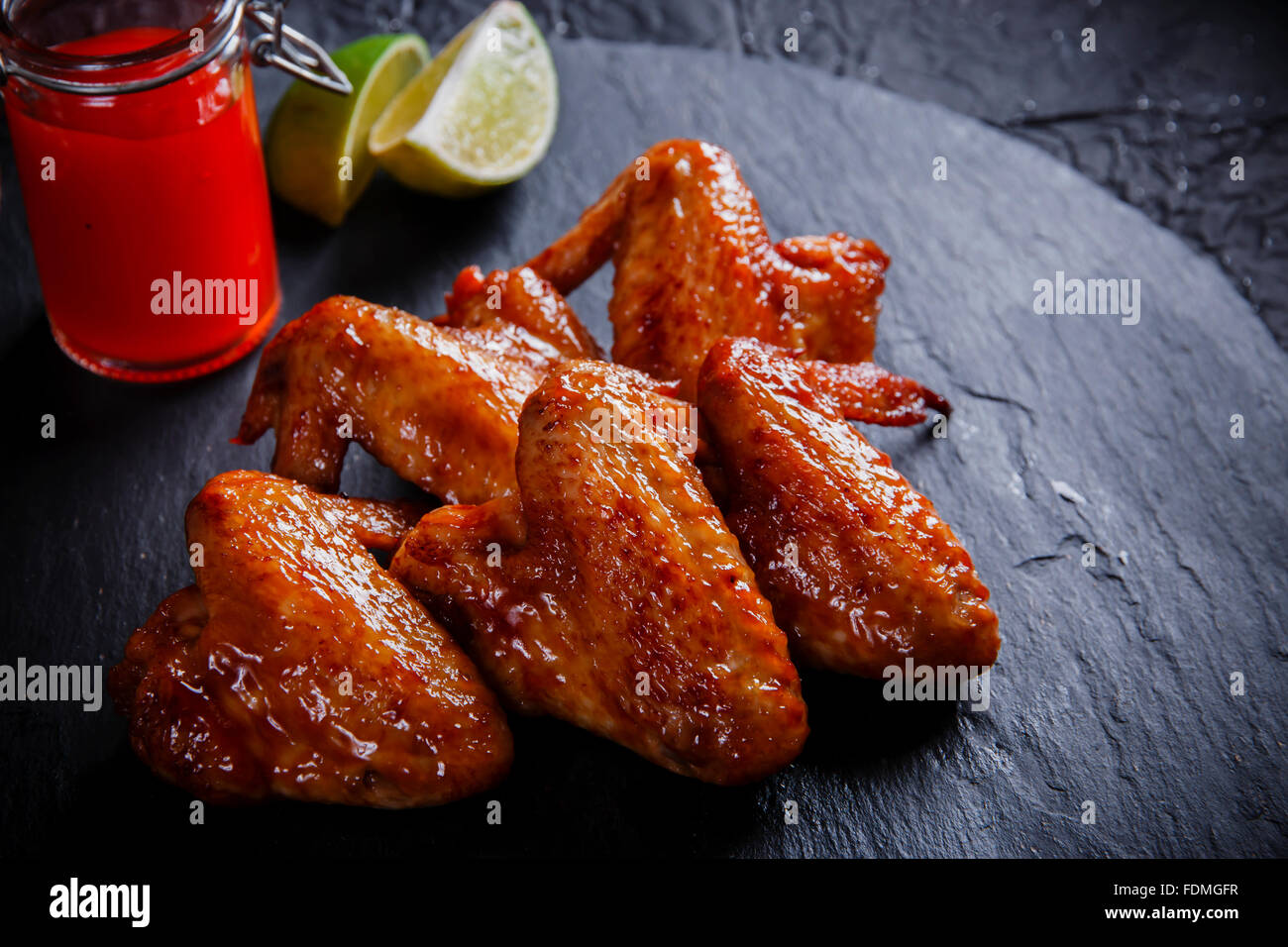 fried chicken wings on a black stone Stock Photo