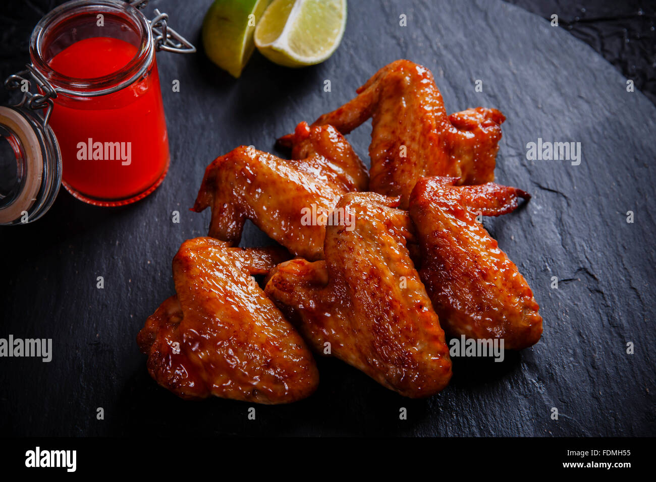 fried chicken wings on a black stone Stock Photo