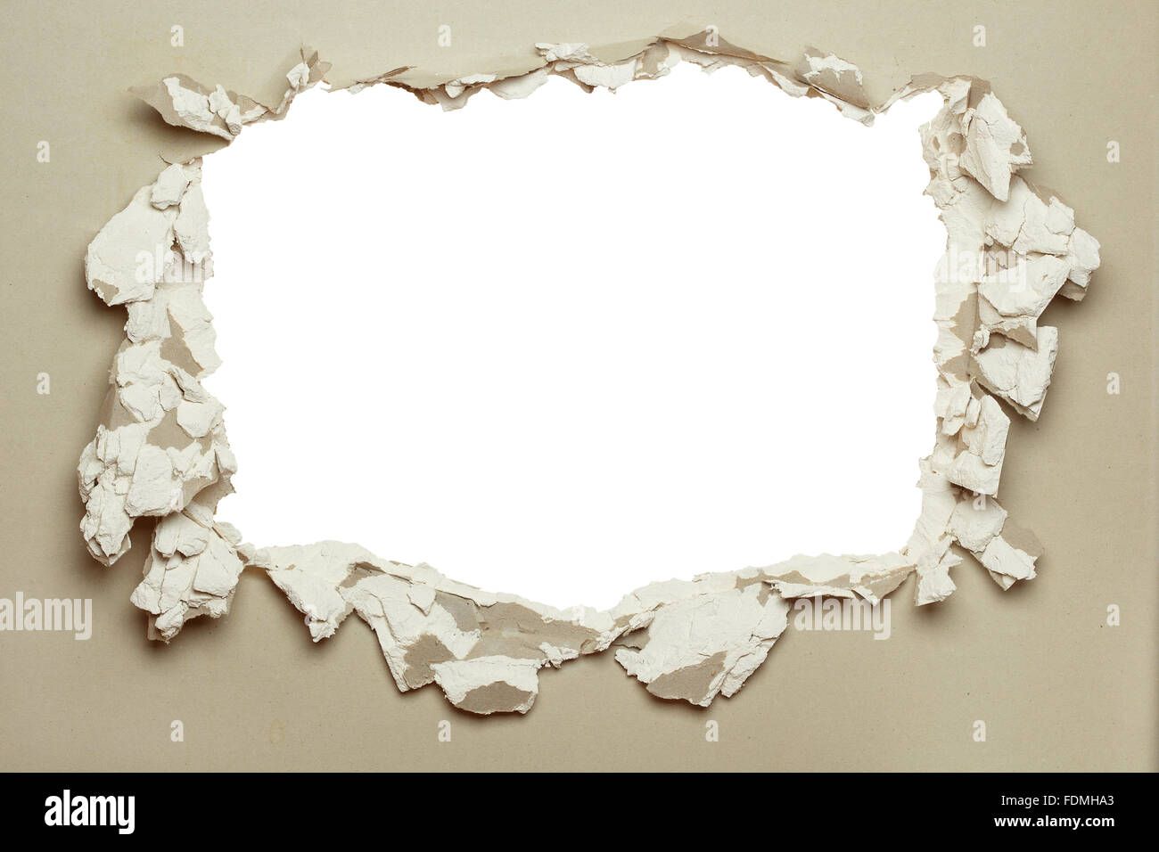 Hole in the grey plasterboard with uneven edges Stock Photo Alamy
