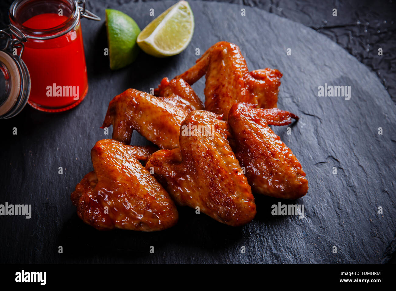 fried chicken wings on a black stone Stock Photo