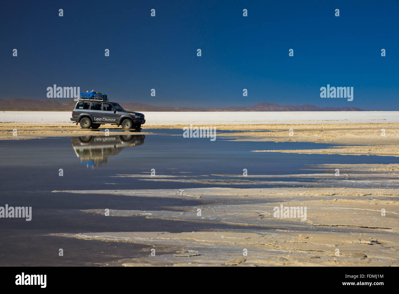 Jeep in the Salar de Uyuni - salt desert in the Altiplano Stock Photo