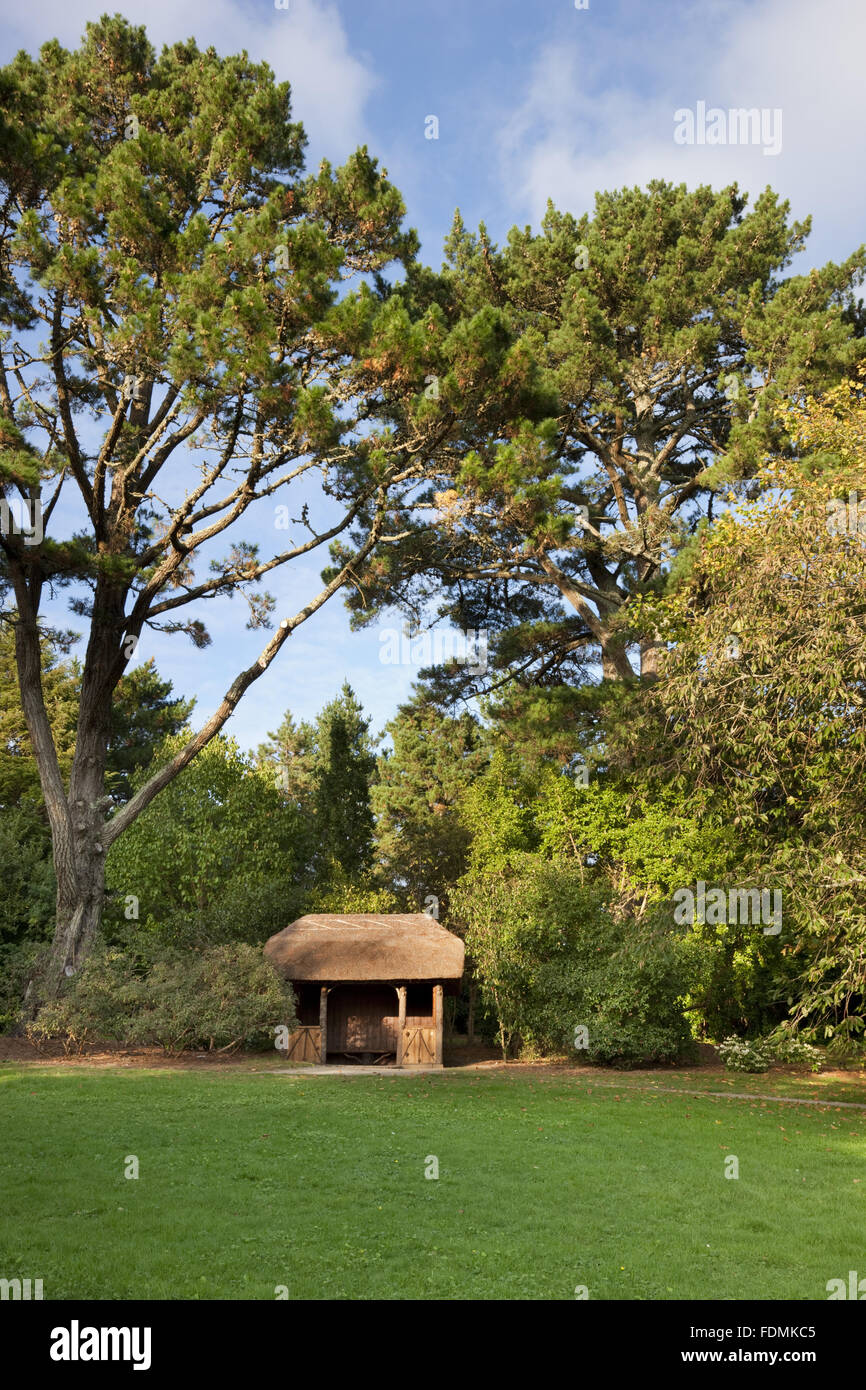 The thatched rustic summer house in Carcaddon at Trelissick Garden, Cornwall. Stock Photo