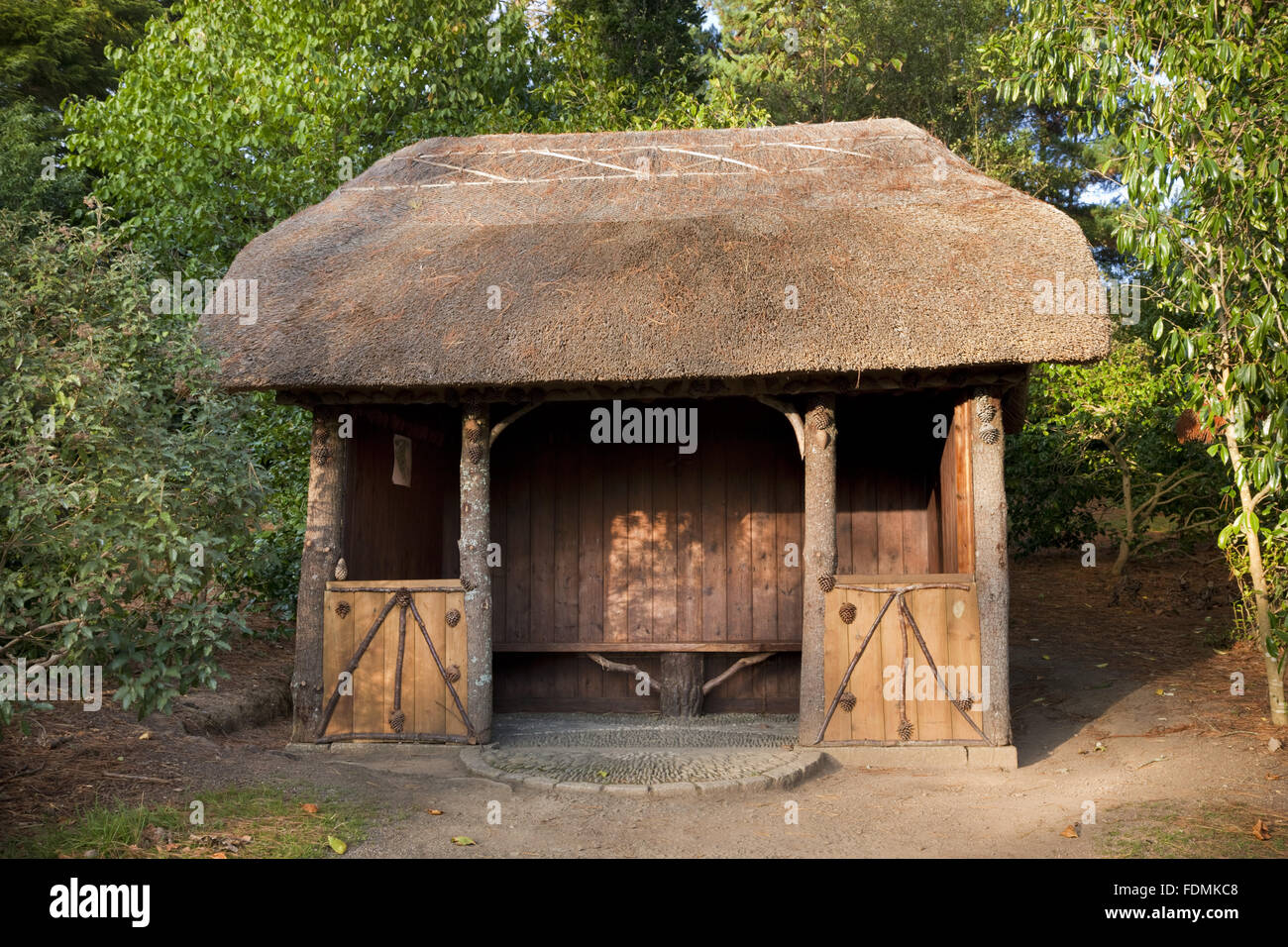 The thatched rustic summer house in Carcaddon at Trelissick Garden, Cornwall. Stock Photo