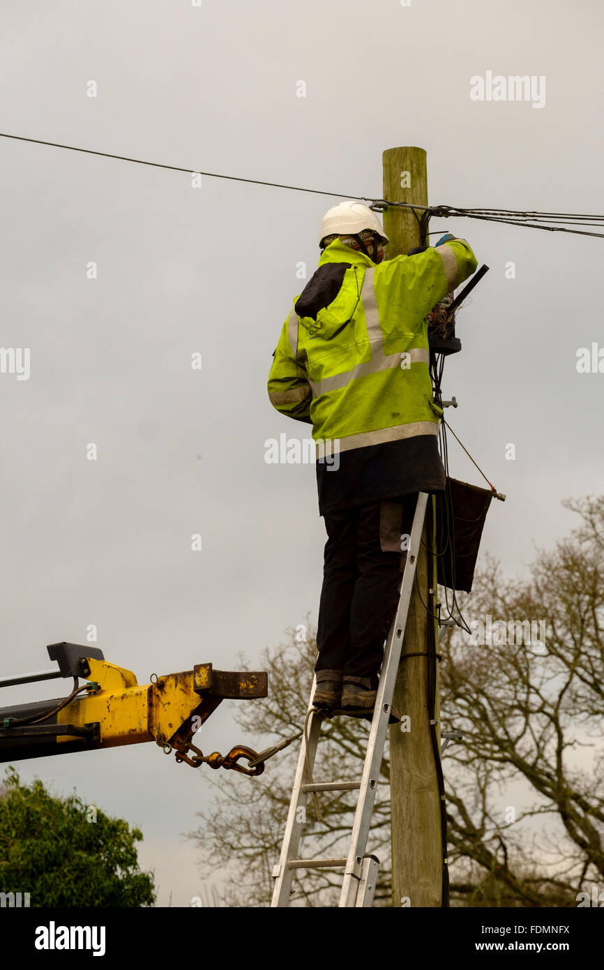 British Telecom engineer replacing a telegraph pole in Salisbury on a cold wintry day Stock Photo