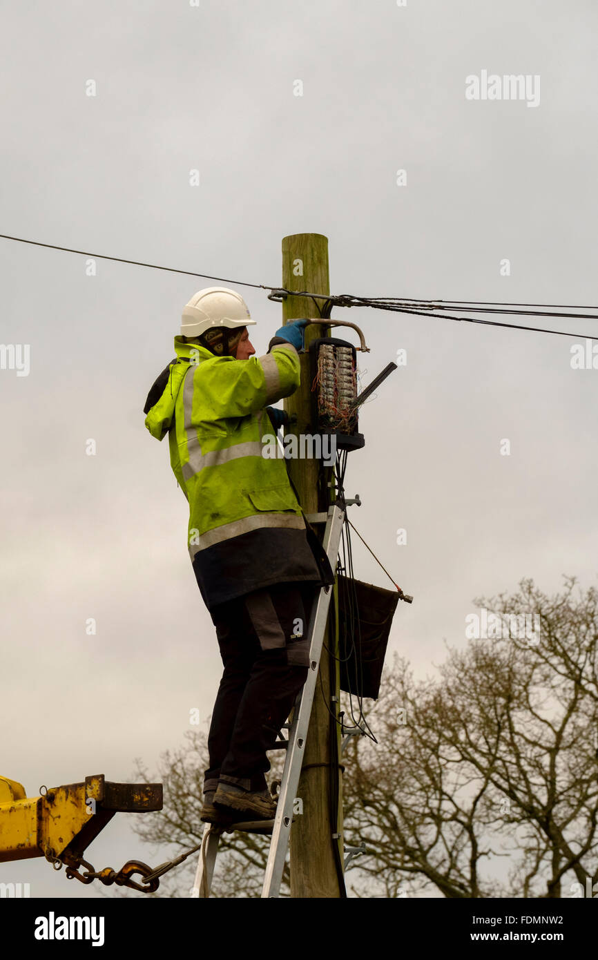 British Telecom engineer replacing a telegraph pole in Salisbury on a cold wintry day Stock Photo