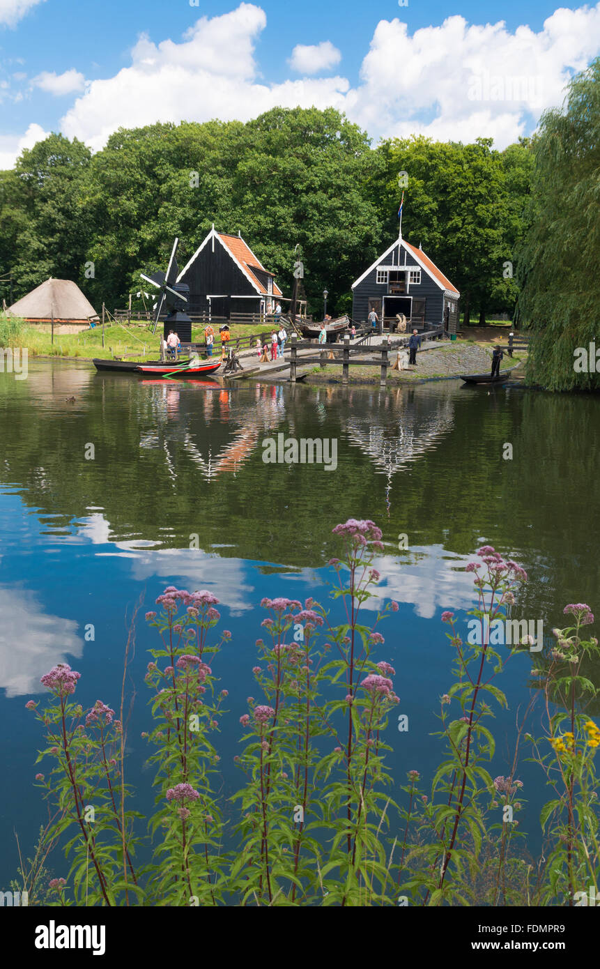 ARNHEM, NETHERLANDS - JULY 26, 2015: Unknown tourists in the Netherlands Open Air museum. The museum shows the Dutch history fro Stock Photo