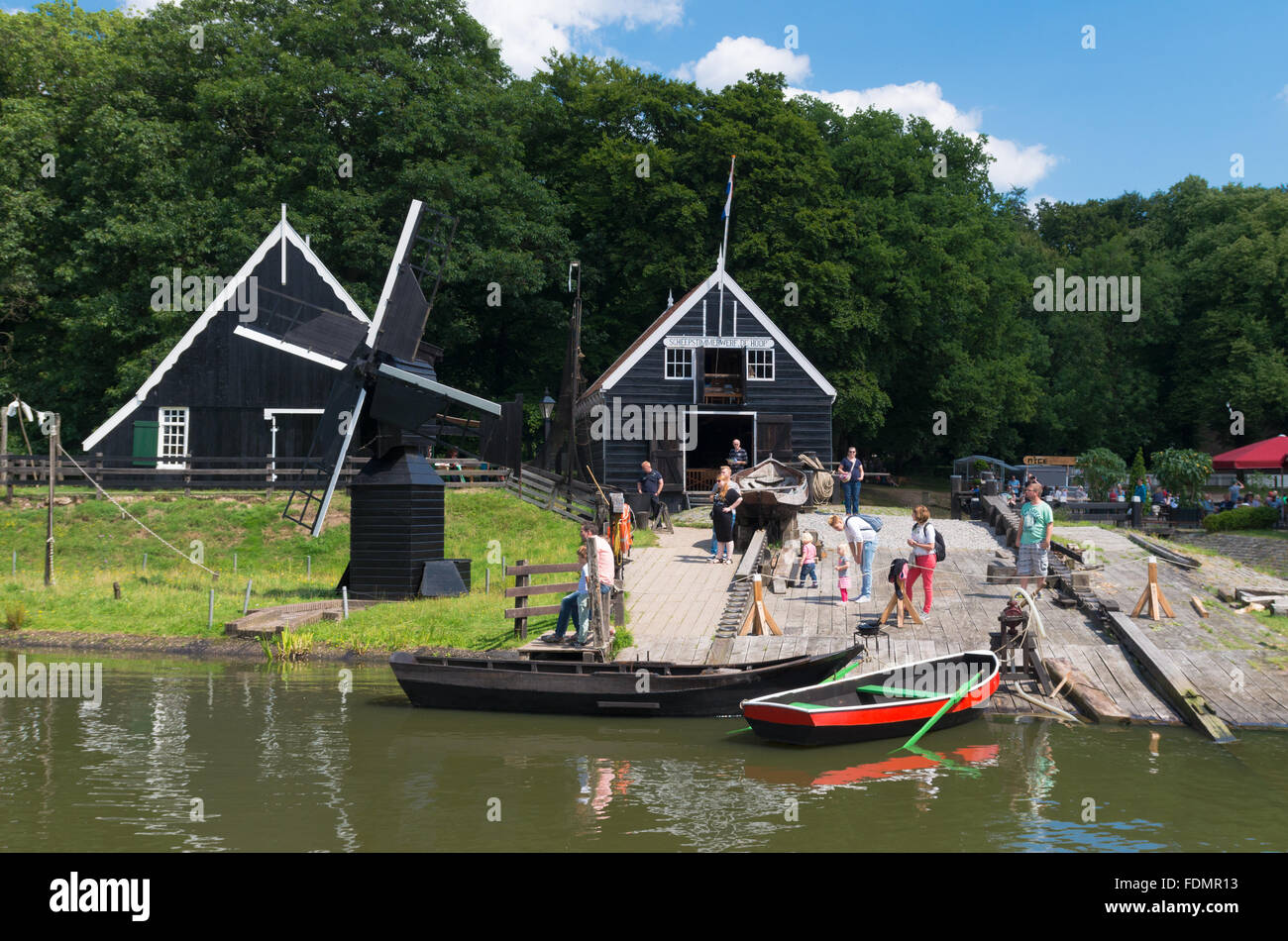 ARNHEM, NETHERLANDS - JULY 26, 2015: Unknown tourists in the Netherlands Open Air museum. The museum shows the Dutch history fro Stock Photo
