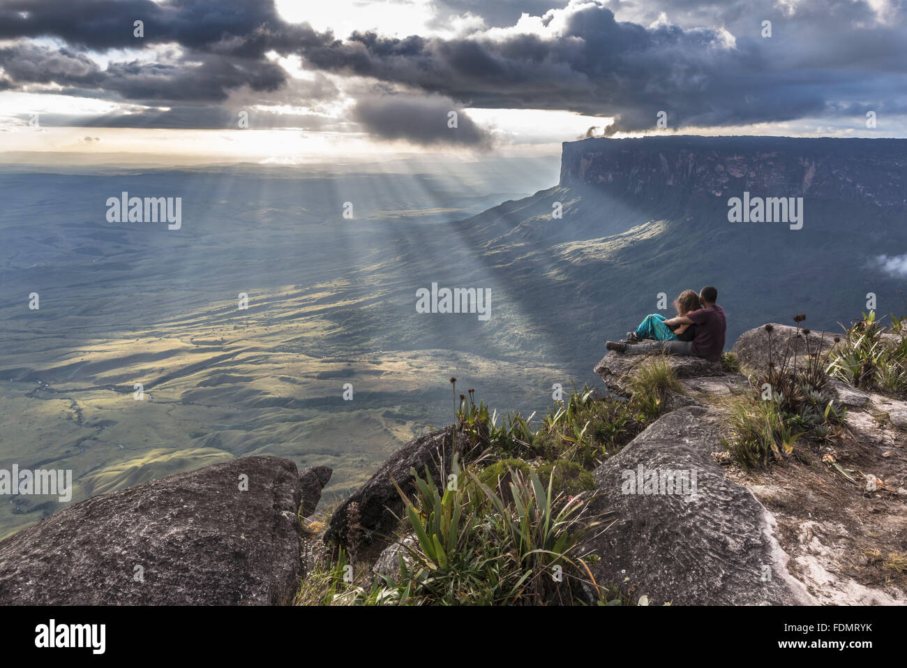 Tourists contemplating for sunsets in the Mount Roraima National Park - Sierra de Pacaraima Stock Photo